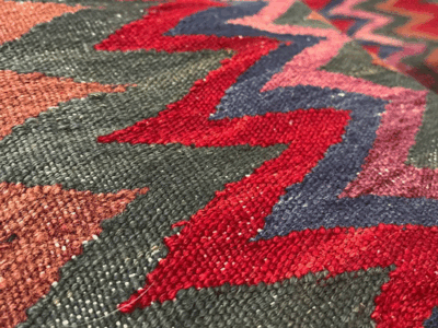 Sirjan sofreh, a kilim woven with wool.