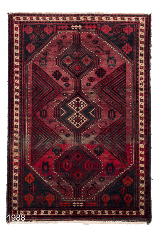 Dark themed geometric pattern wool persian carpet with different shades of red