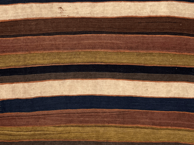 A stripe pattenr kilim with Abrash colors green and brown